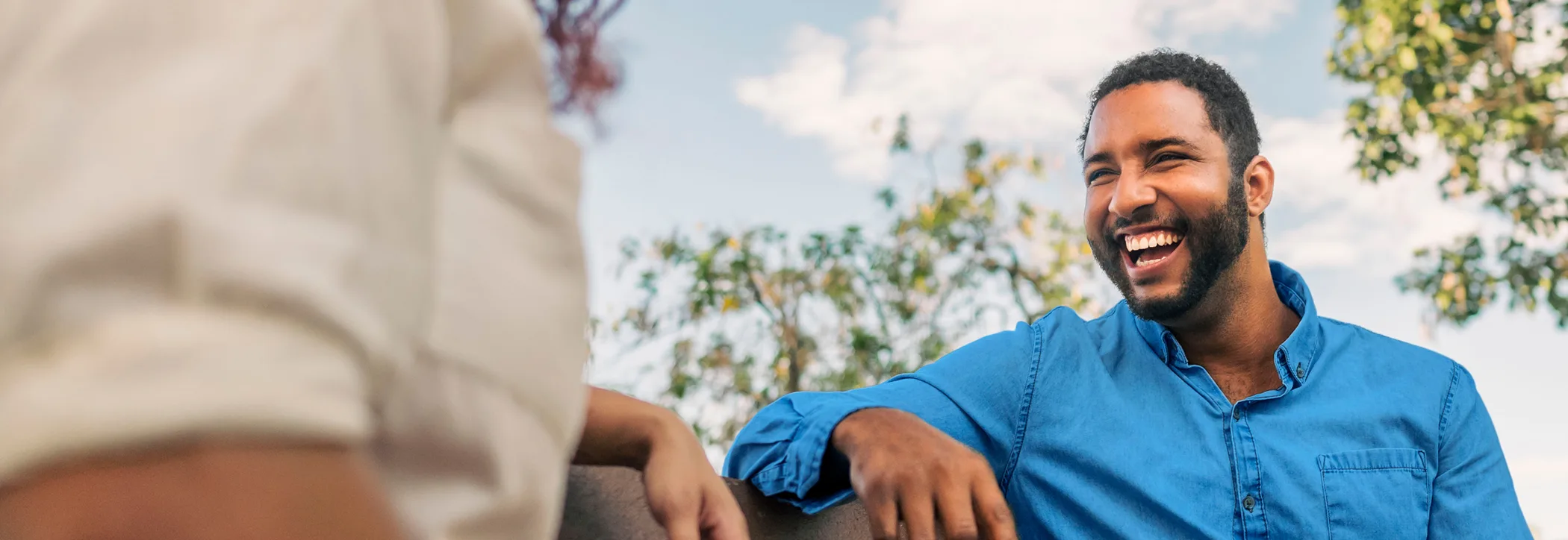 A man smiling outdoors